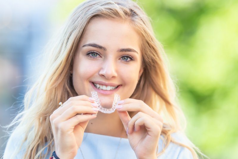 person with Invisalign smiling