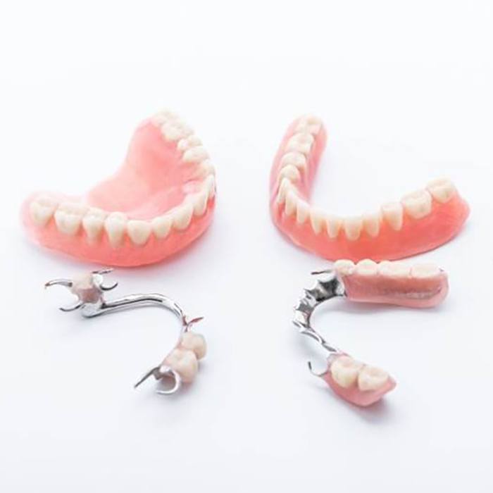 two full dentures and two partial dentures