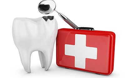 Tooth next to red first aid kit