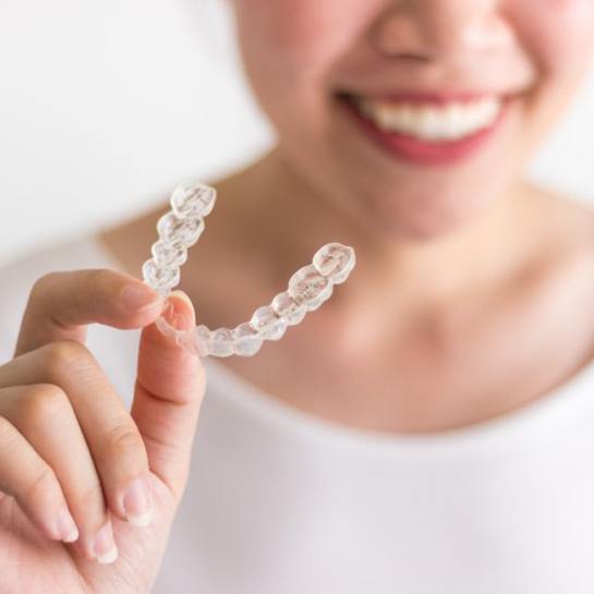 person holding a tray for Invisalign in Grove City 
