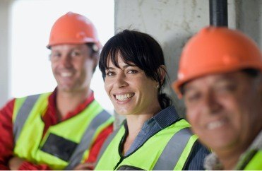 Constructions workers with healthy smiles thanks to preventive dentistry